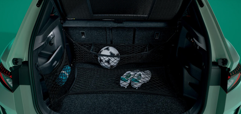 Rear boot space of a Skoda Elroq with sports gear under netting