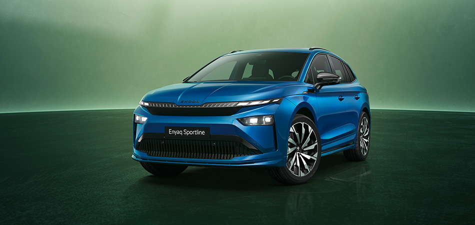 A blue Skoda SUV on a green studio background