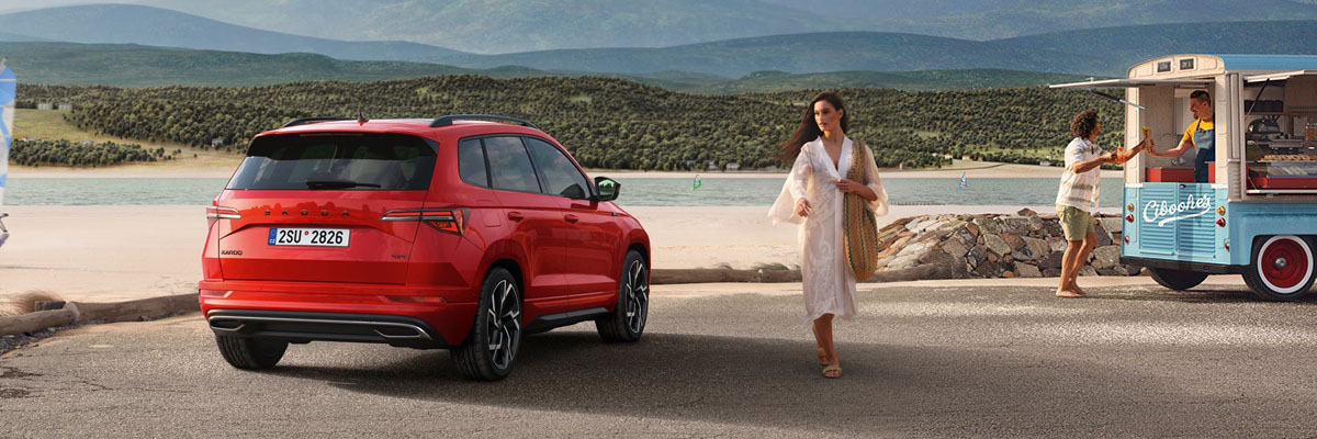 Side view of an red Karoq driving