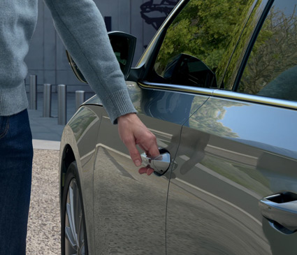 A man opening the door of a skoda