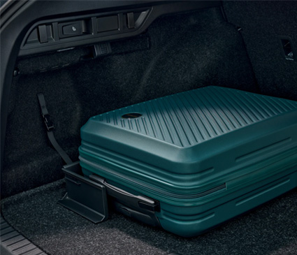 Suitcase held in place with cargo fasteners in a car book